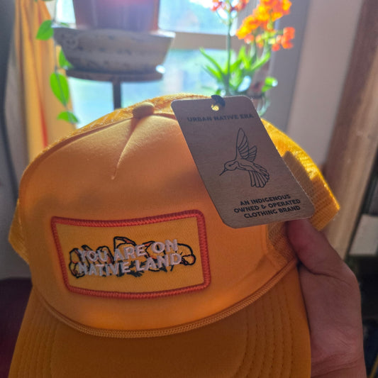 'YOU ARE ON NATIVE LAND' POPPY TRUCKER HAT